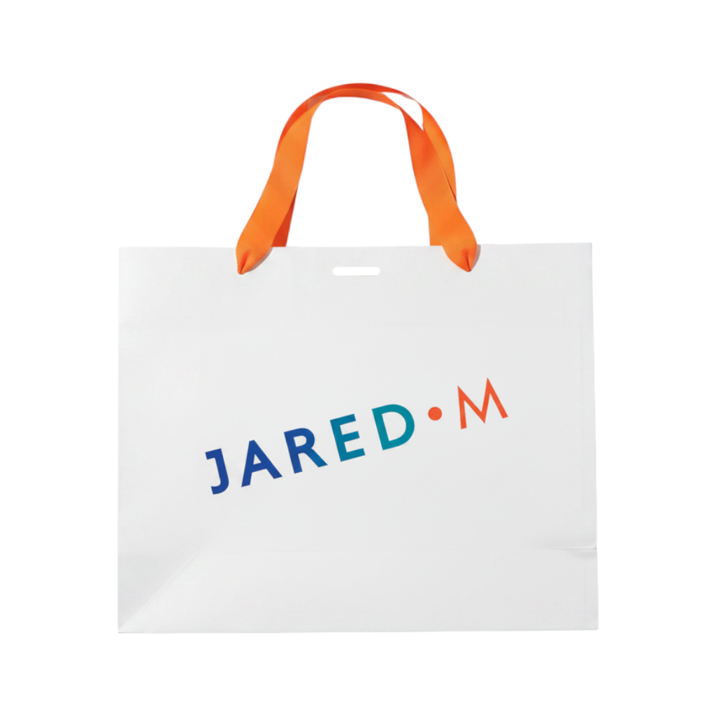 My Little J white paper shopping bag with orange ribbon handles and blue and orange logo branding